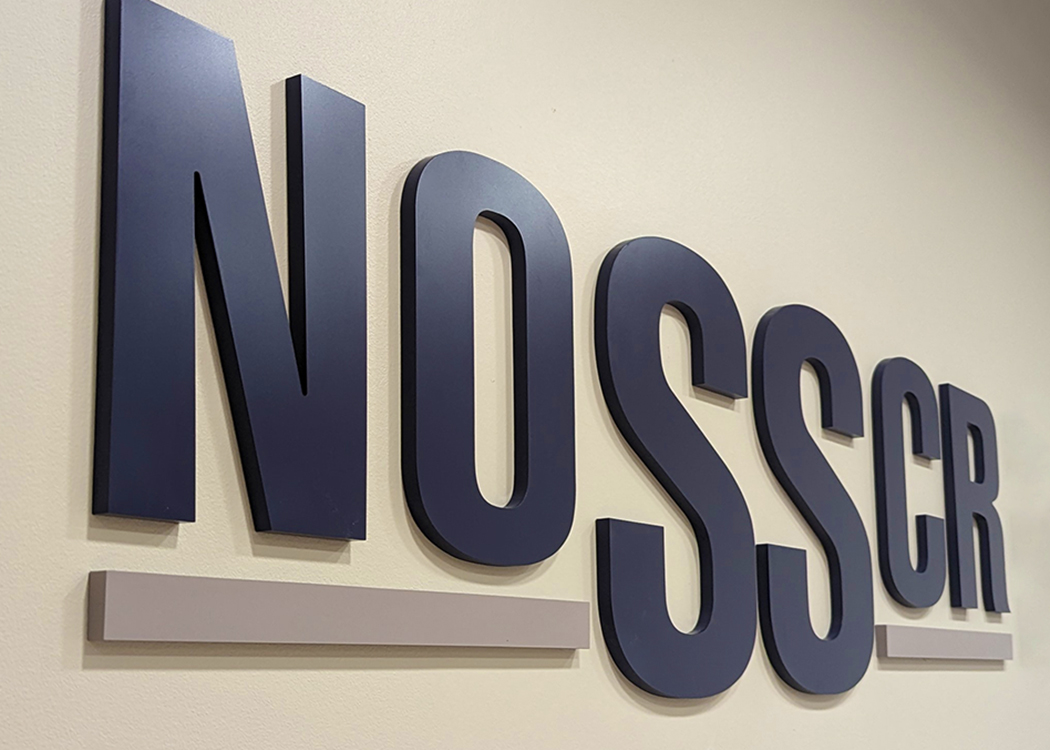 A photo of the NOSSCR sign in NOSSCR's new offices.