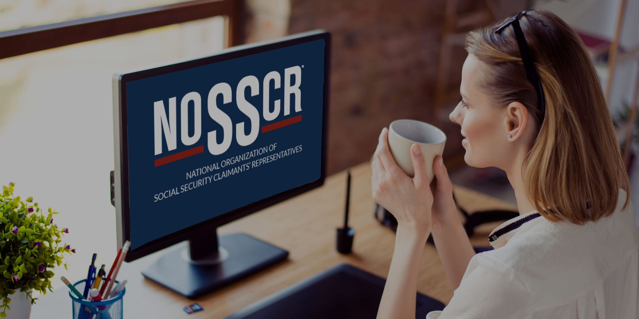 Back view of a woman looking at a screen displaying the NOSSCR logo.