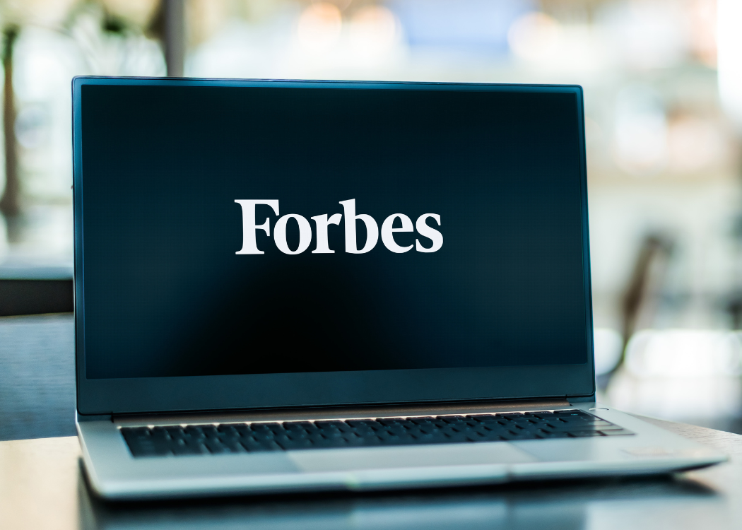 Forbes website displayed on a laptop